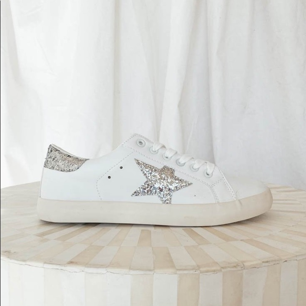 White sneakers with silver star